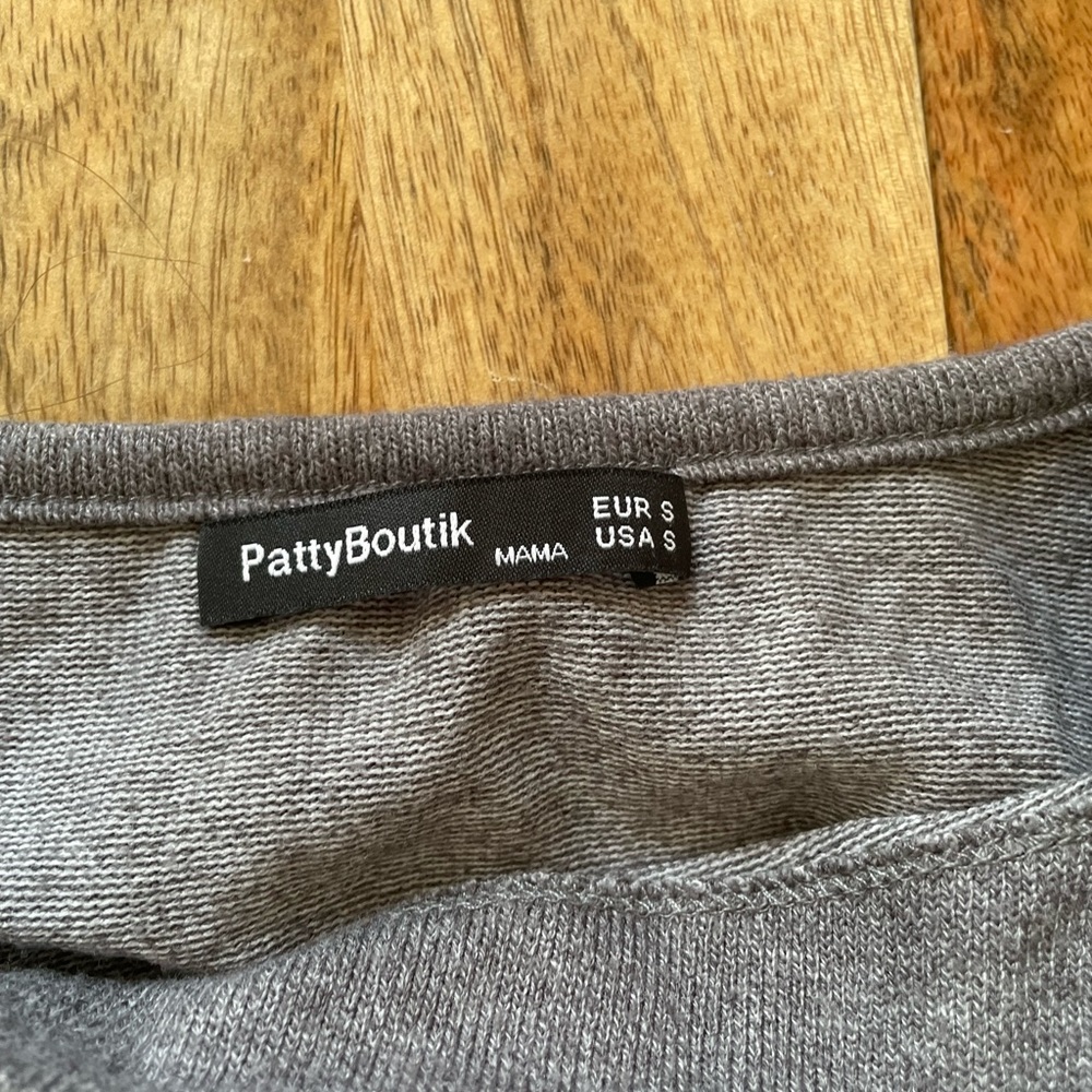 Two long sleeve maternity tops with side buttons. Purple and gray. Lightly worn.